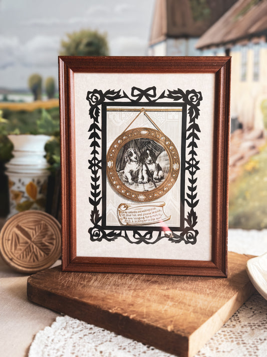 Framed antique postcard of puppies in the rain