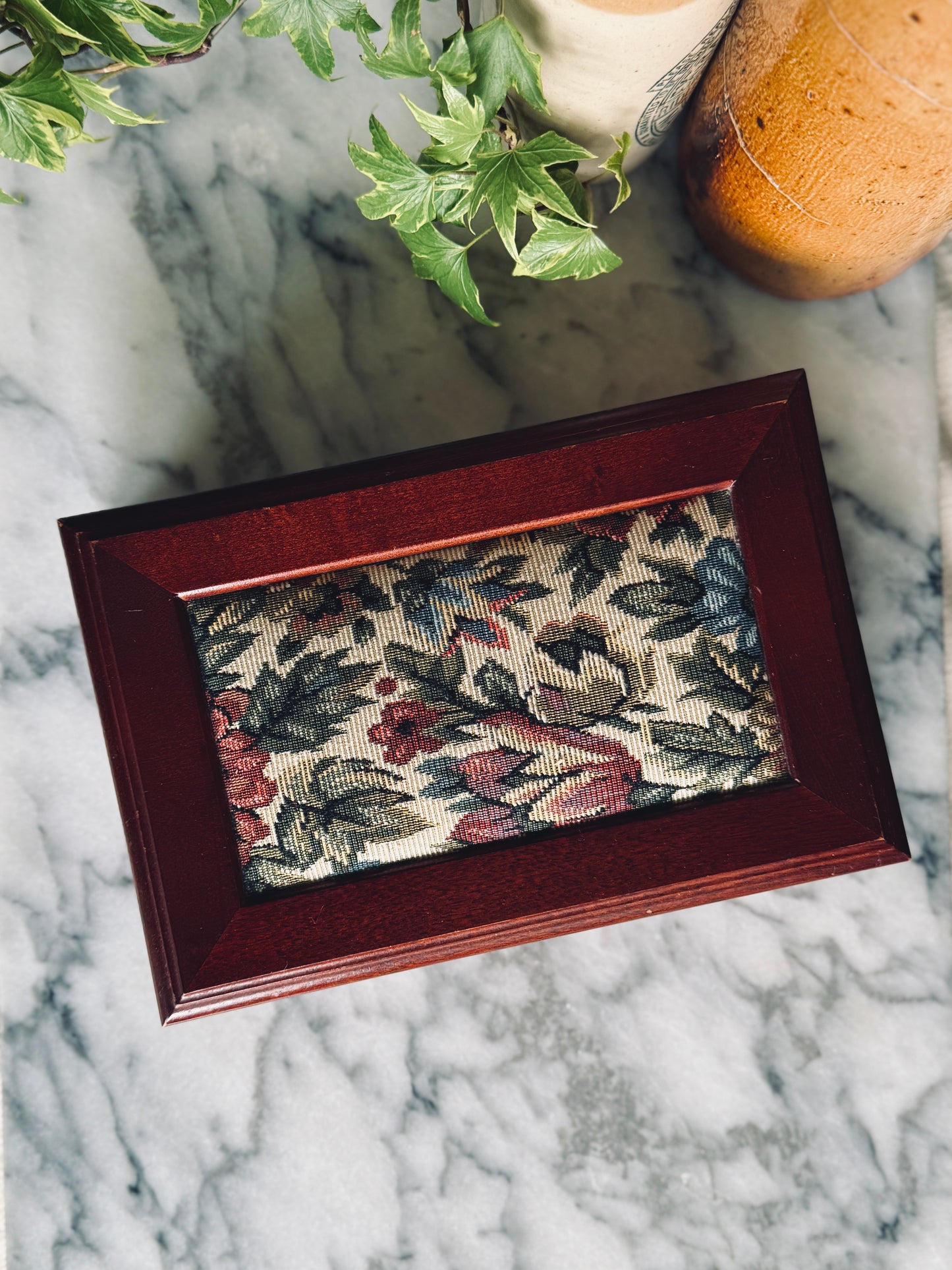 Wooden jewelry box with floral fabric inlay on lid