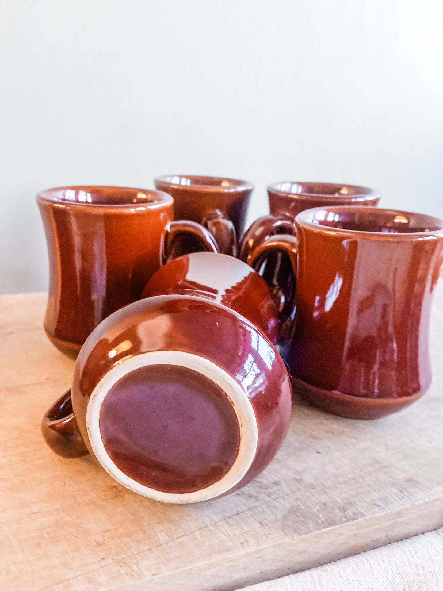 Bottom of Vintage brown stoneware diner mugs  