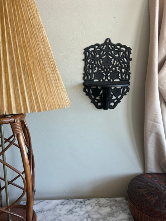 Cast iron wall shelf with leaf motif
