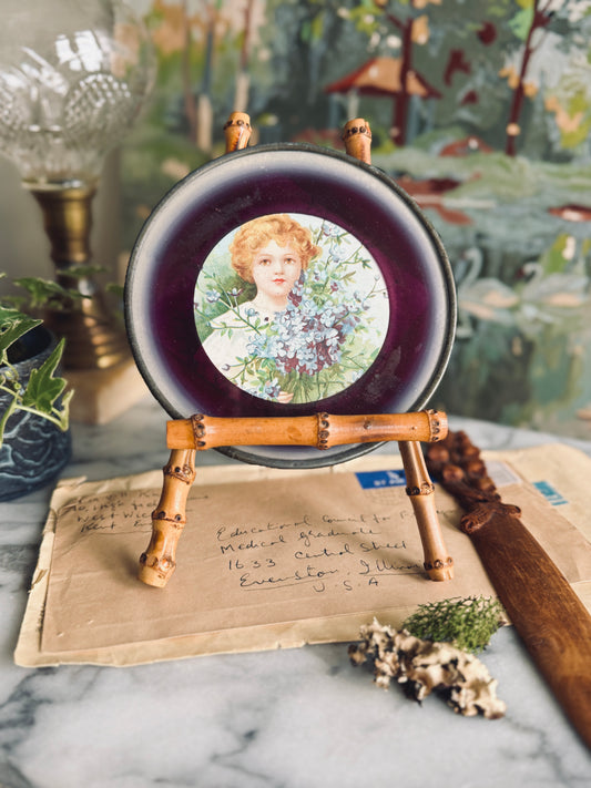 Small antique flue cover with portrait of a girl