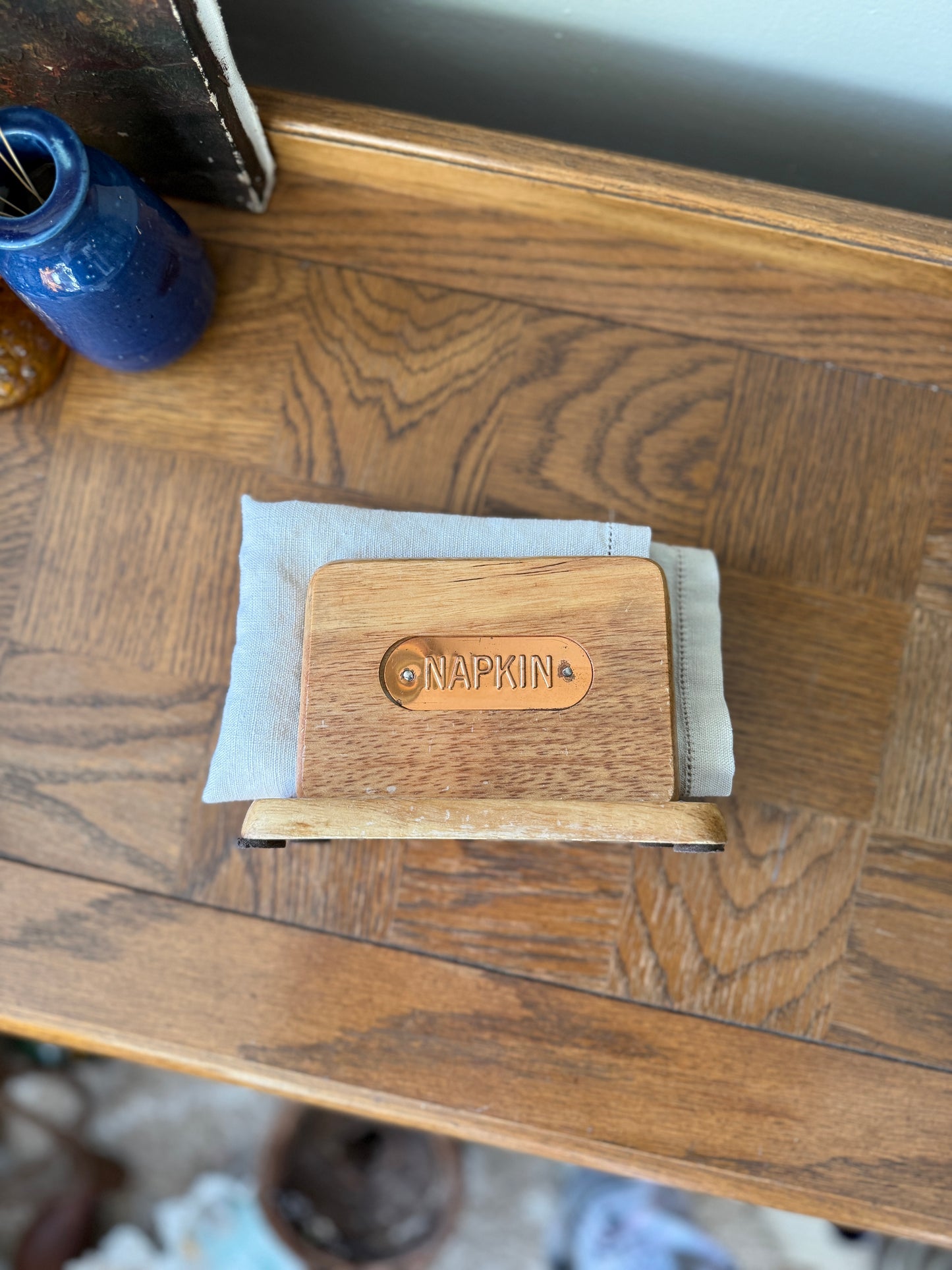 Wooden napkin holder with copper plate