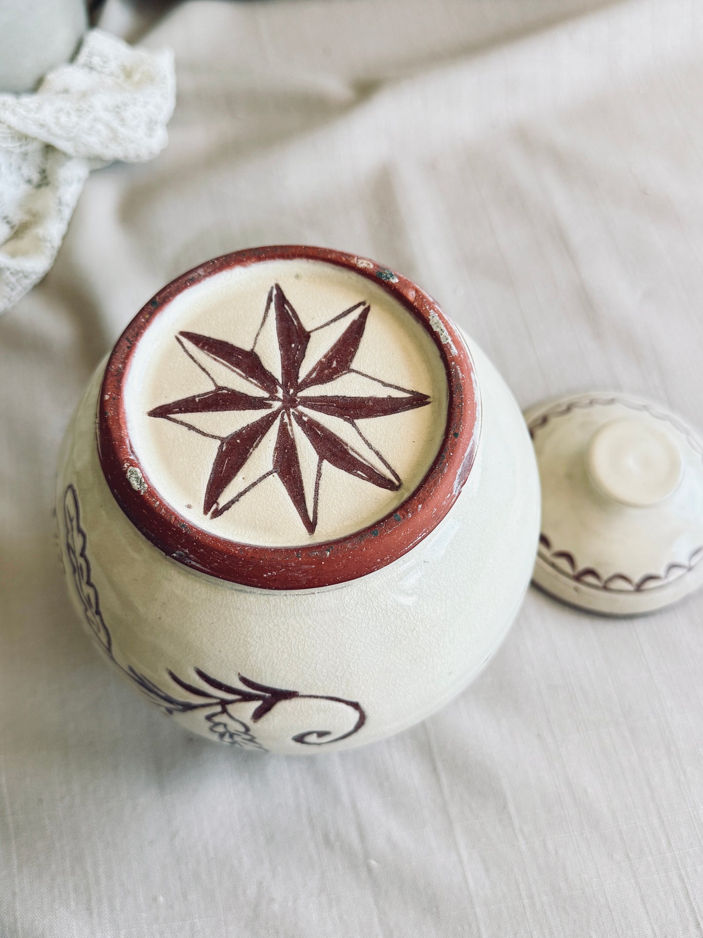 Pottery cookie jar with floral design