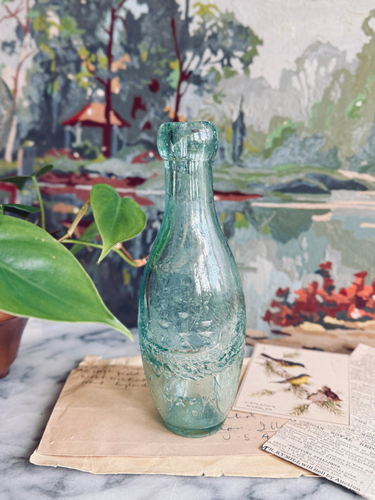 Antique aqua glass bottle