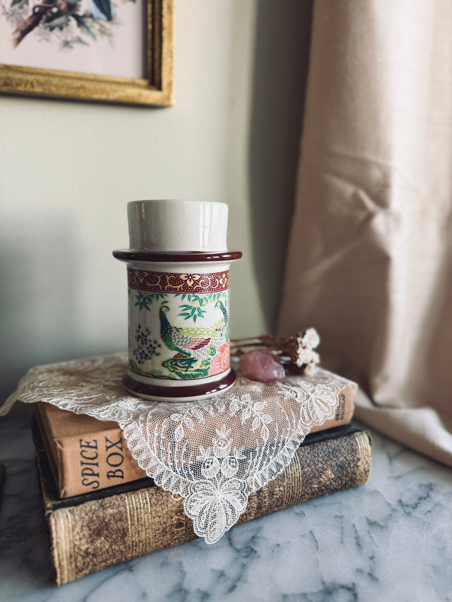 Porcelain candle holder with peacock