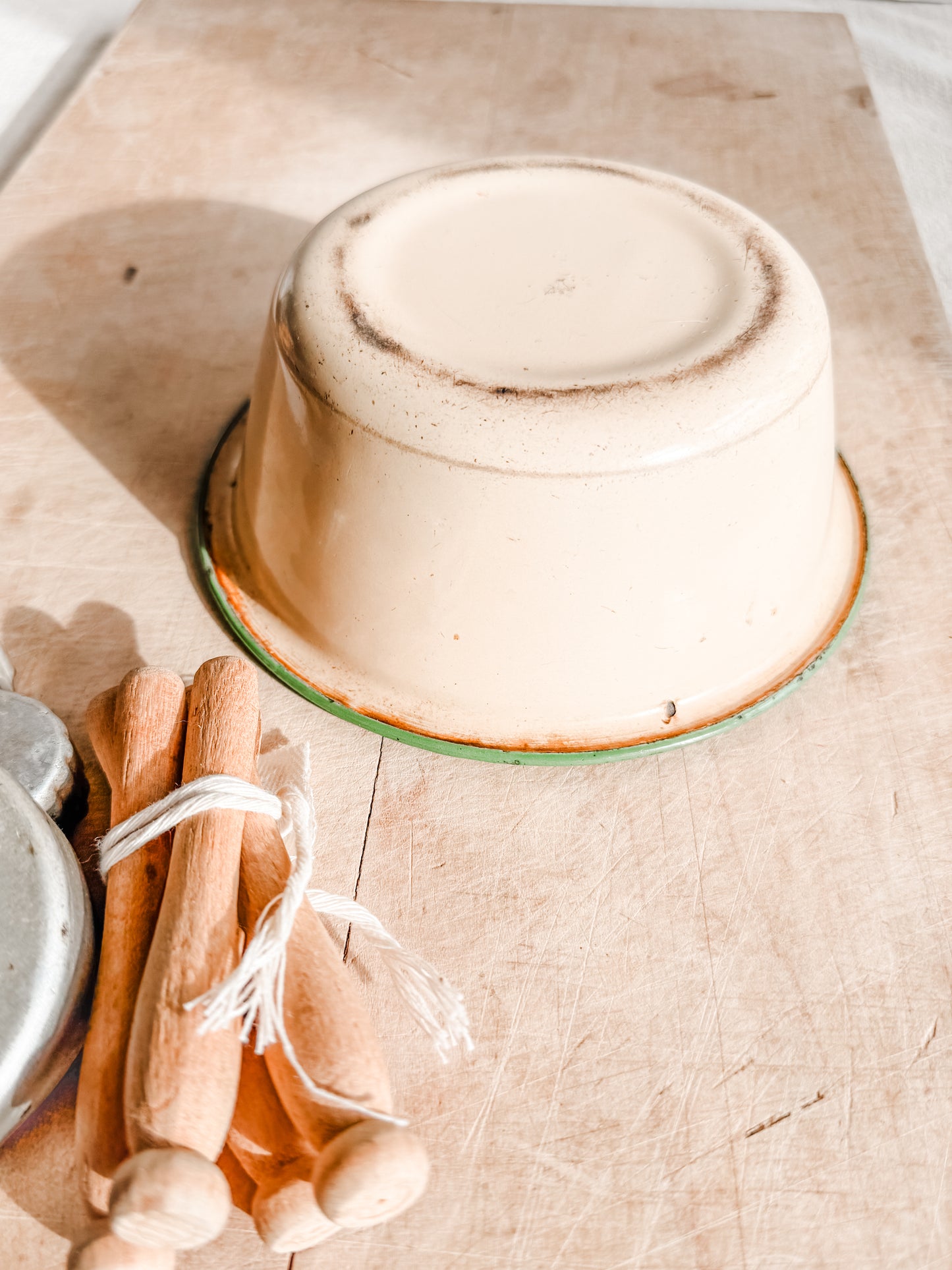 Small Green Rimmed Tan Chippy and Rusty Enamelware dish