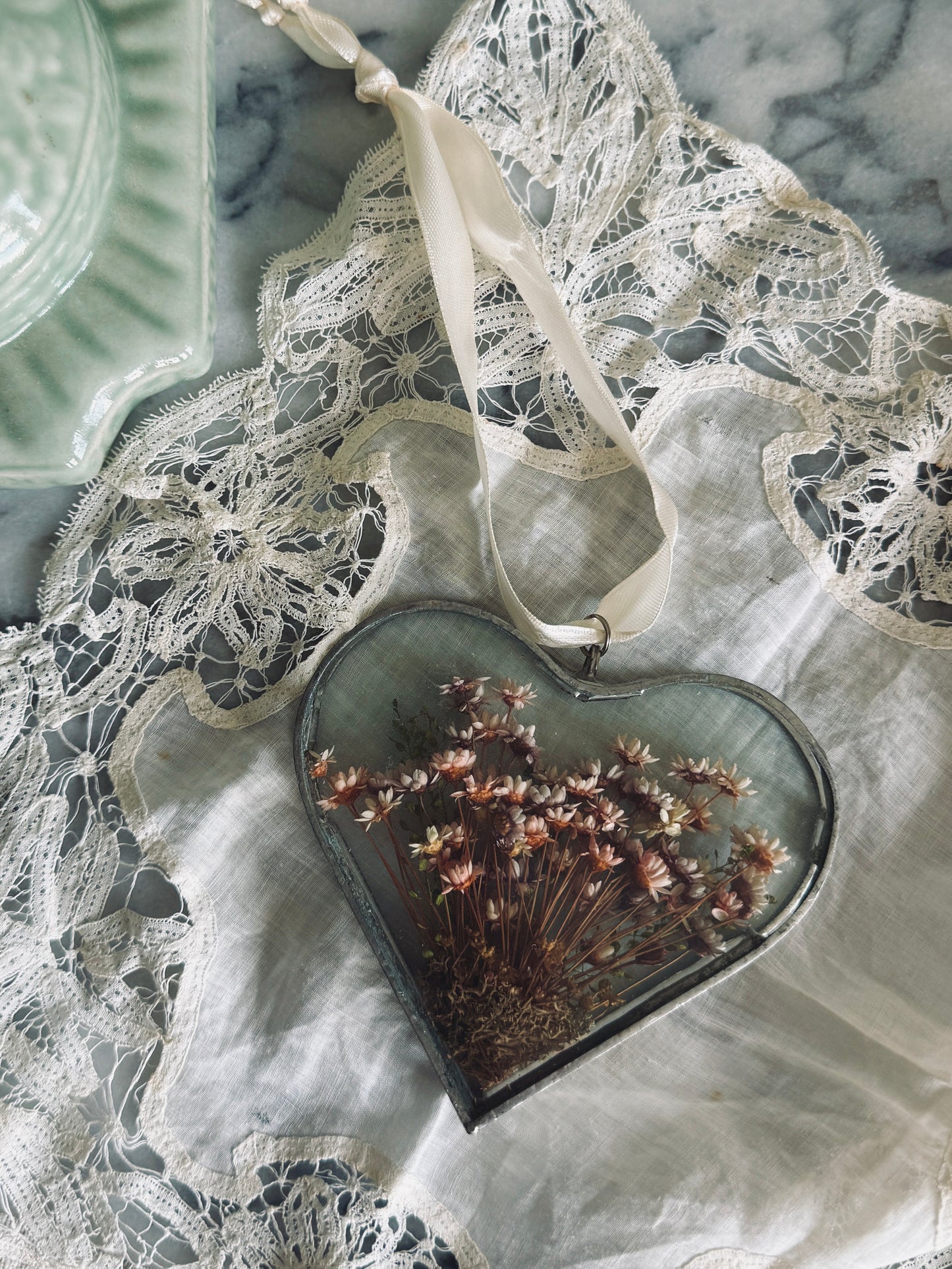 Vintage glass suncatcher with dried floral arrangement