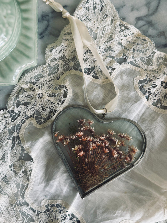 Vintage glass suncatcher with dried floral arrangement
