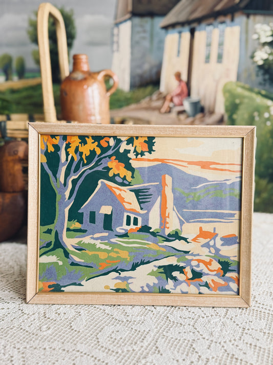 Framed paint by number of a cottage
