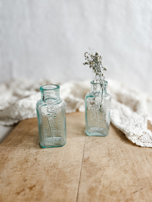 Antique aqua glass Rownstree bottles