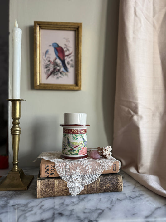 Porcelain candle holder with peacock