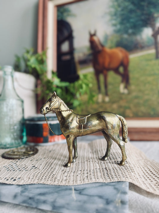 Cast metal horse figurine in gold tone