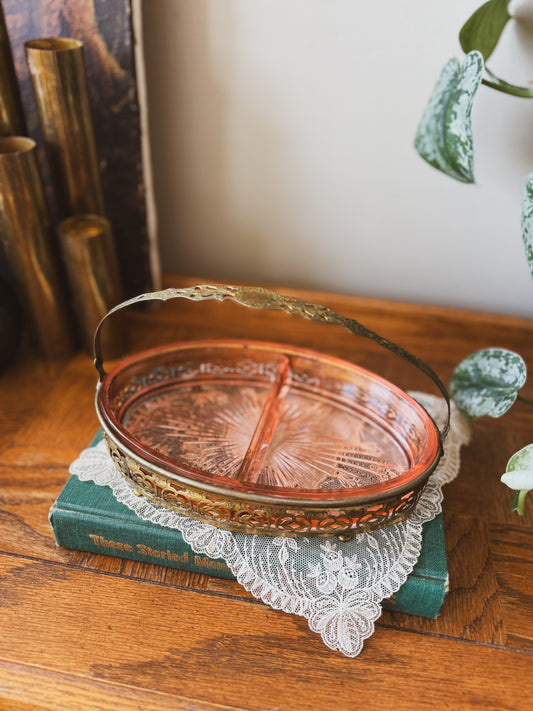 Divided pink depression glass in handled carrier