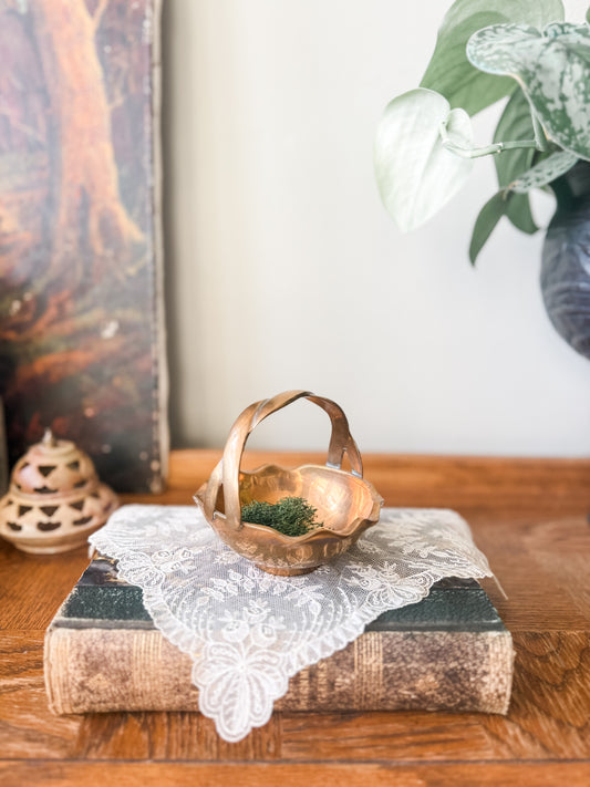 Small brass bowl with rope like handle