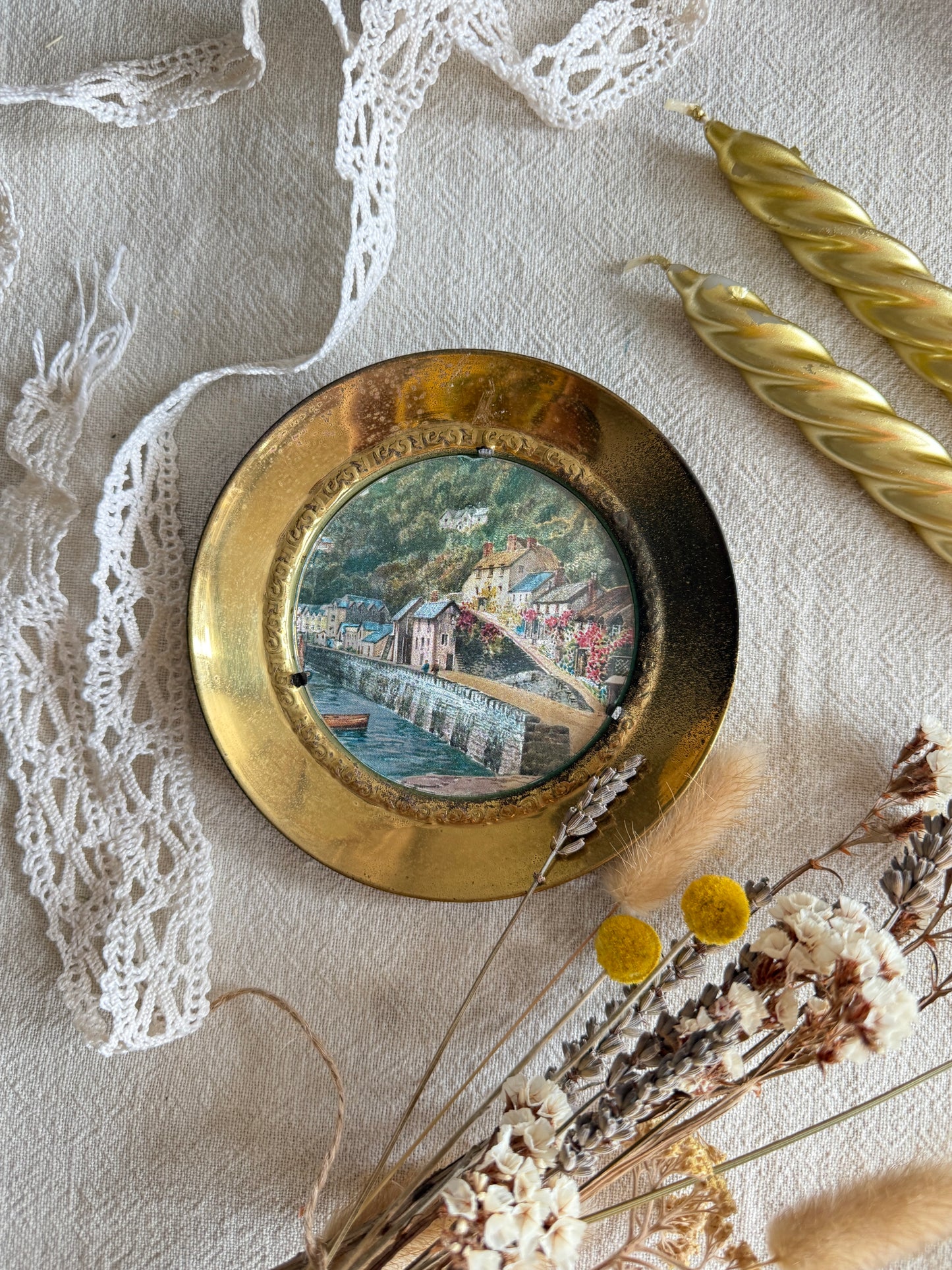 Brass wall plate with town scene
