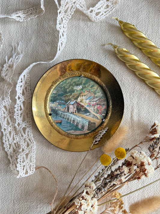 Brass wall plate with town scene