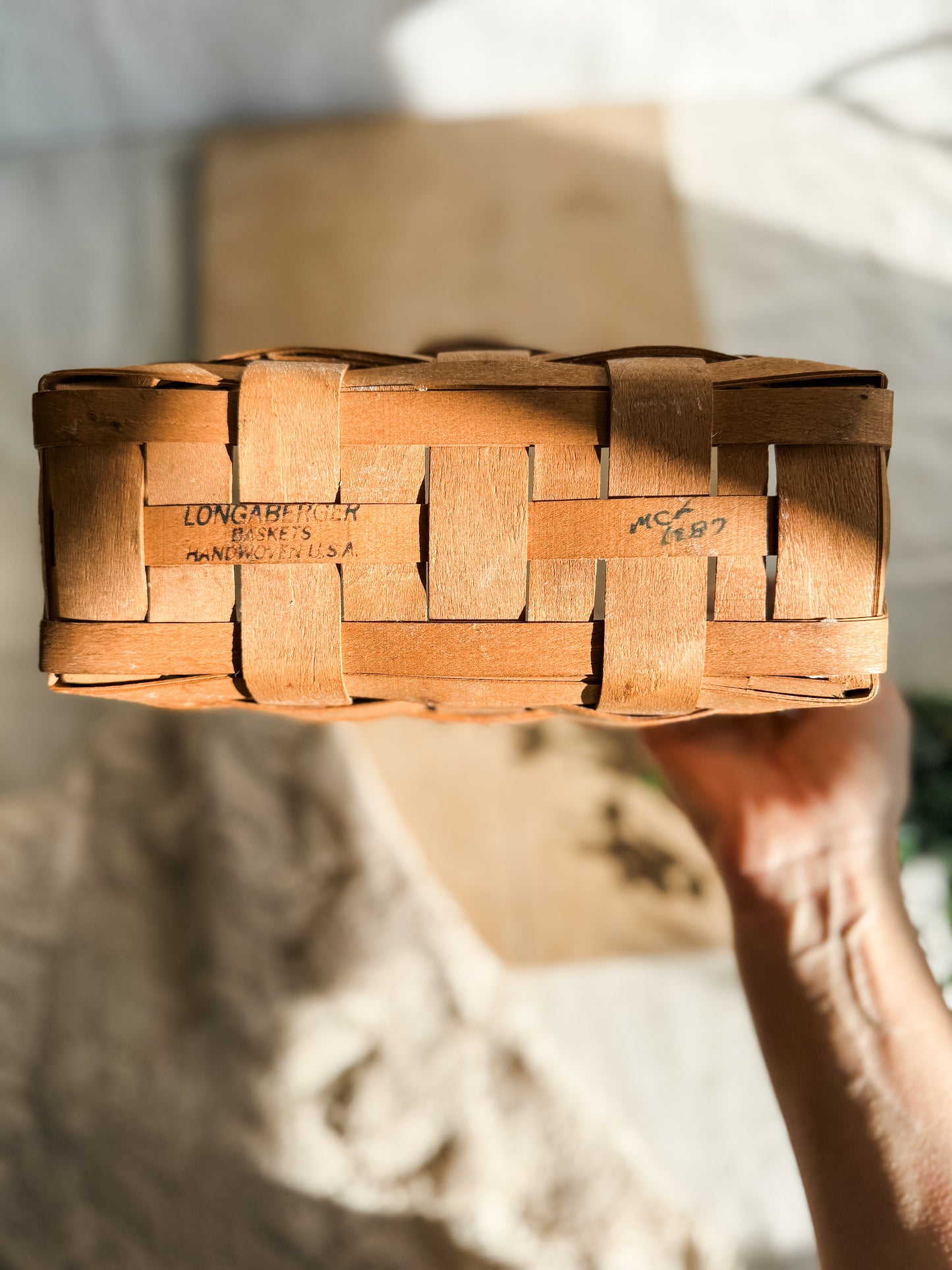 Medium vintage Longaberger woven basket with leather handle and wall hanger