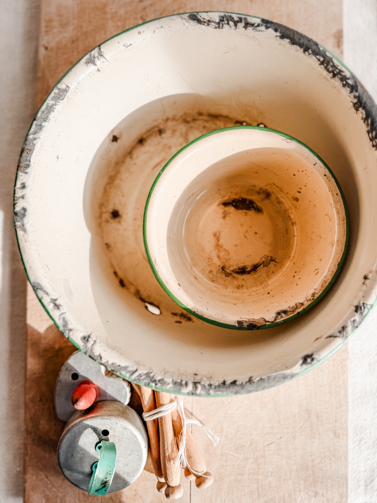 Small Green Rimmed Tan Chippy and Rusty Enamelware dish