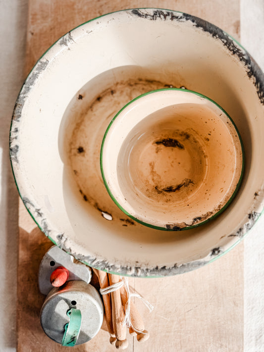 Medium Green Rimmed Tan Rusty and Chippy Enamelware dish