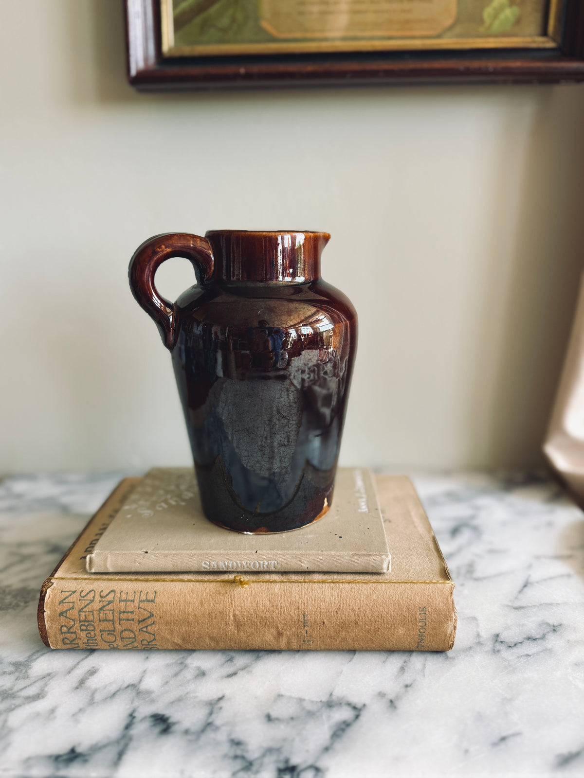 Brown glazed crock pitcher