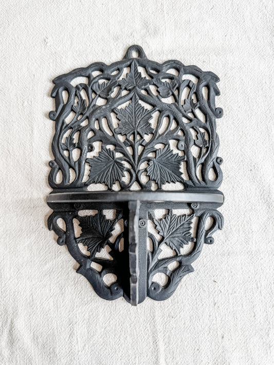 Cast iron wall shelf with leaf motif