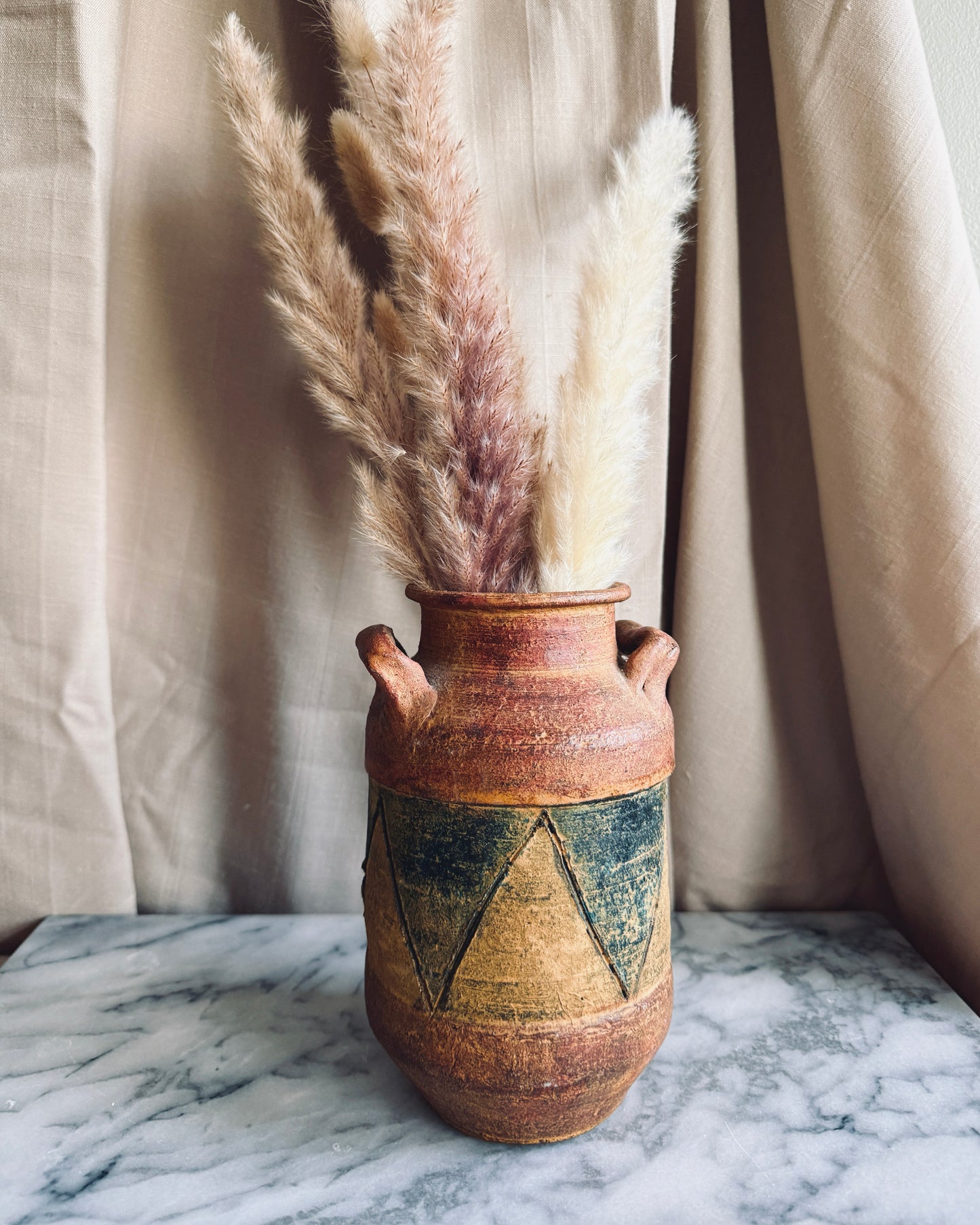 Double handled terracotta vase