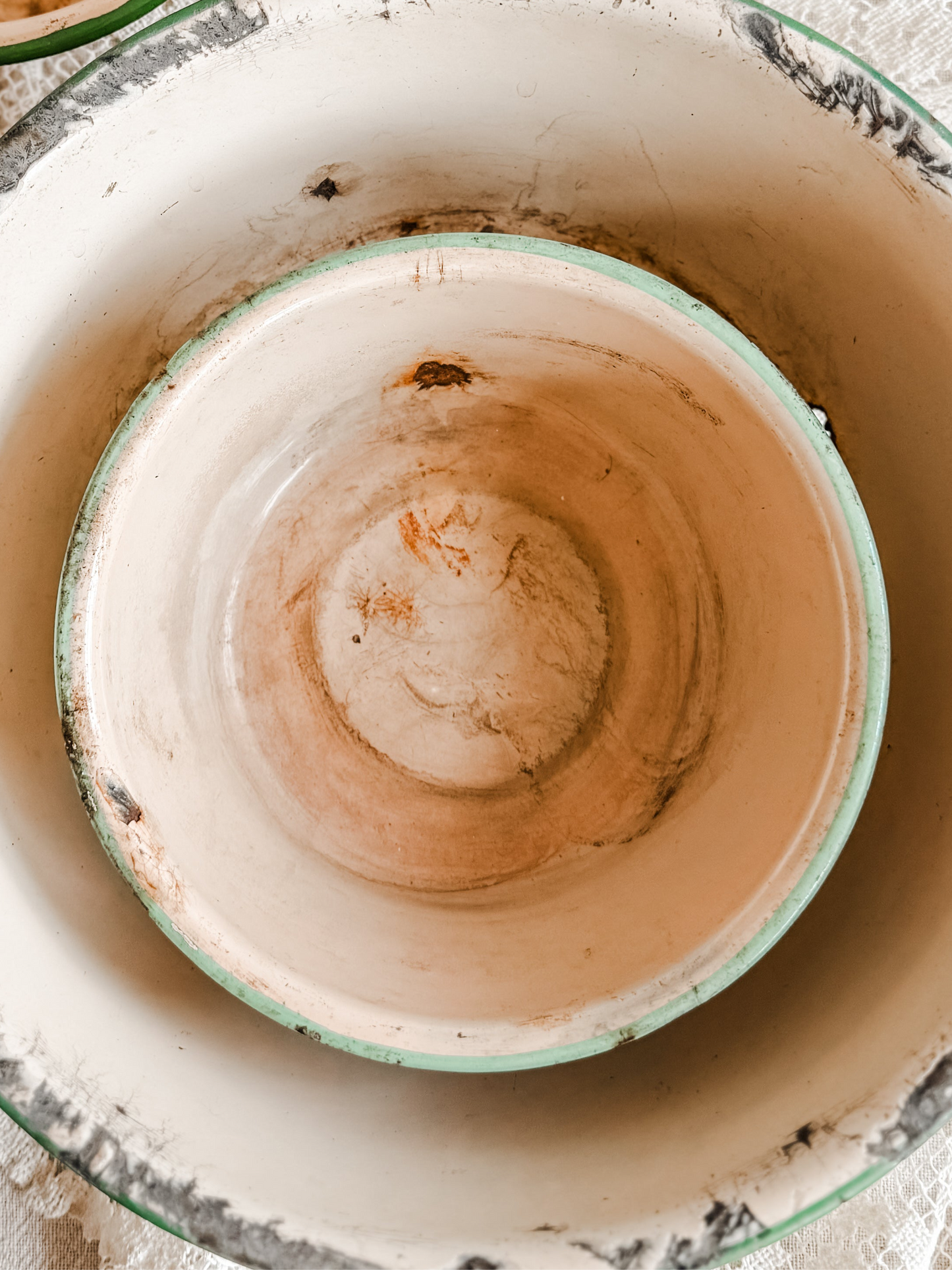 Small Green Rimmed Tan Chippy and Rusty Enamelware dish