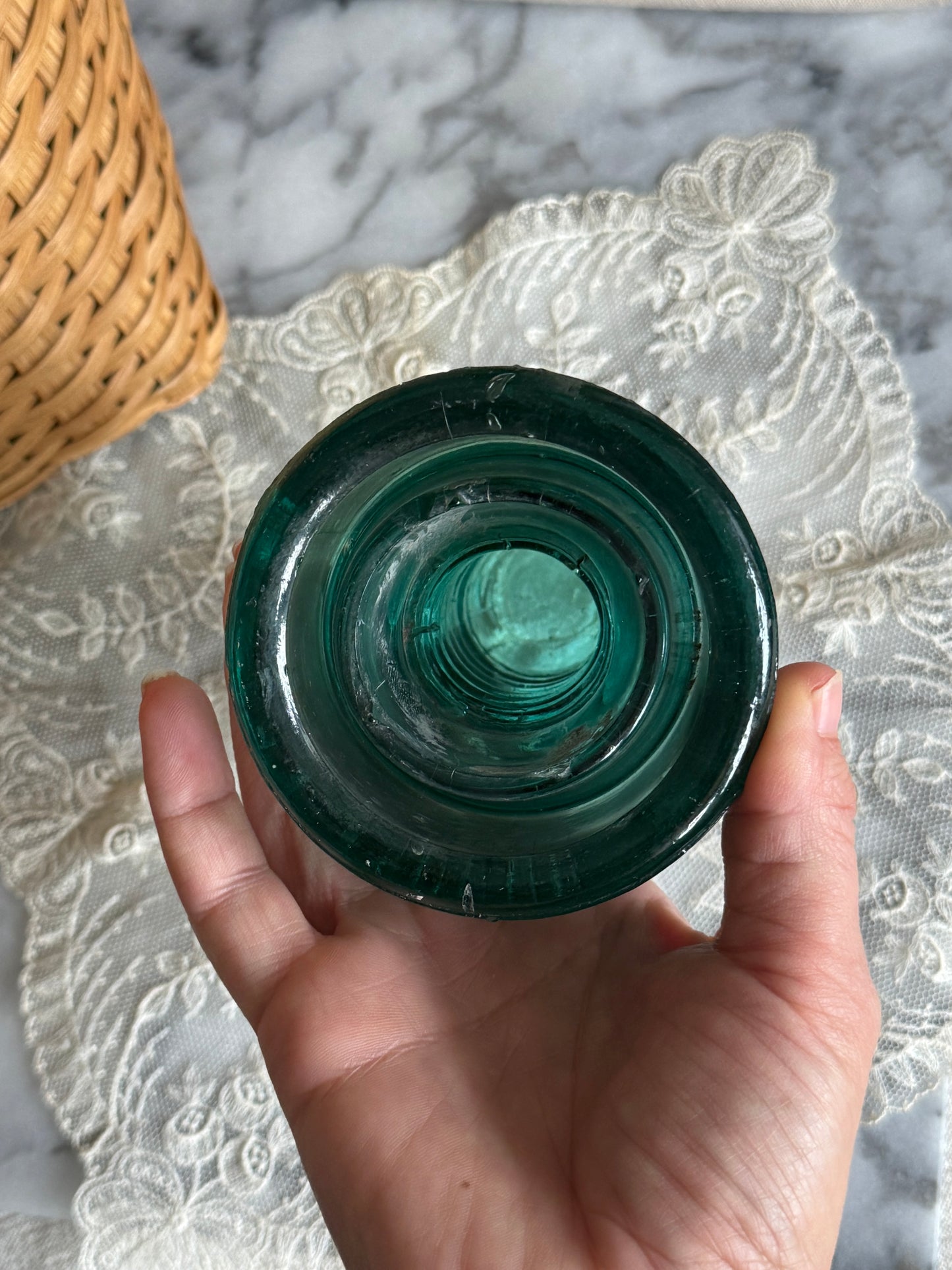 Teal colored glass insulator