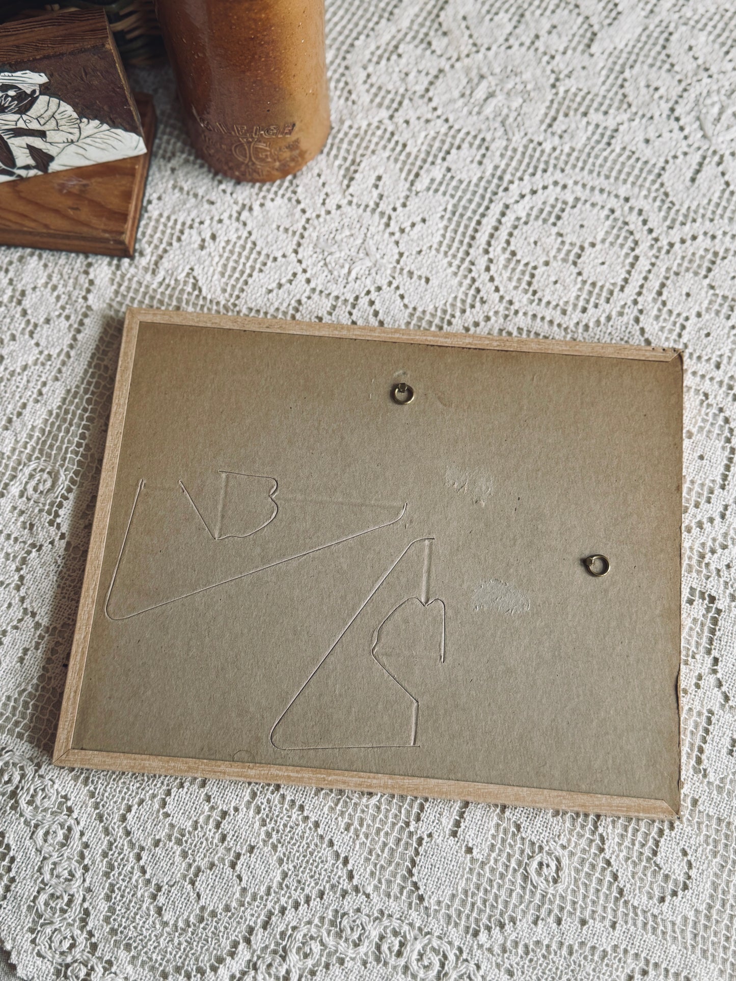 Framed paint by number of a cottage