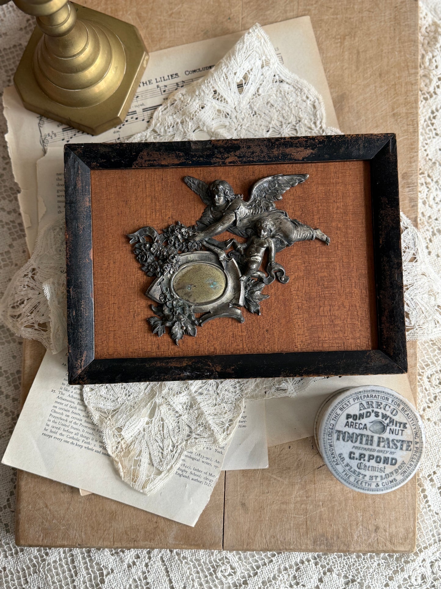 Framed late 19th century medallion of angel and cherub