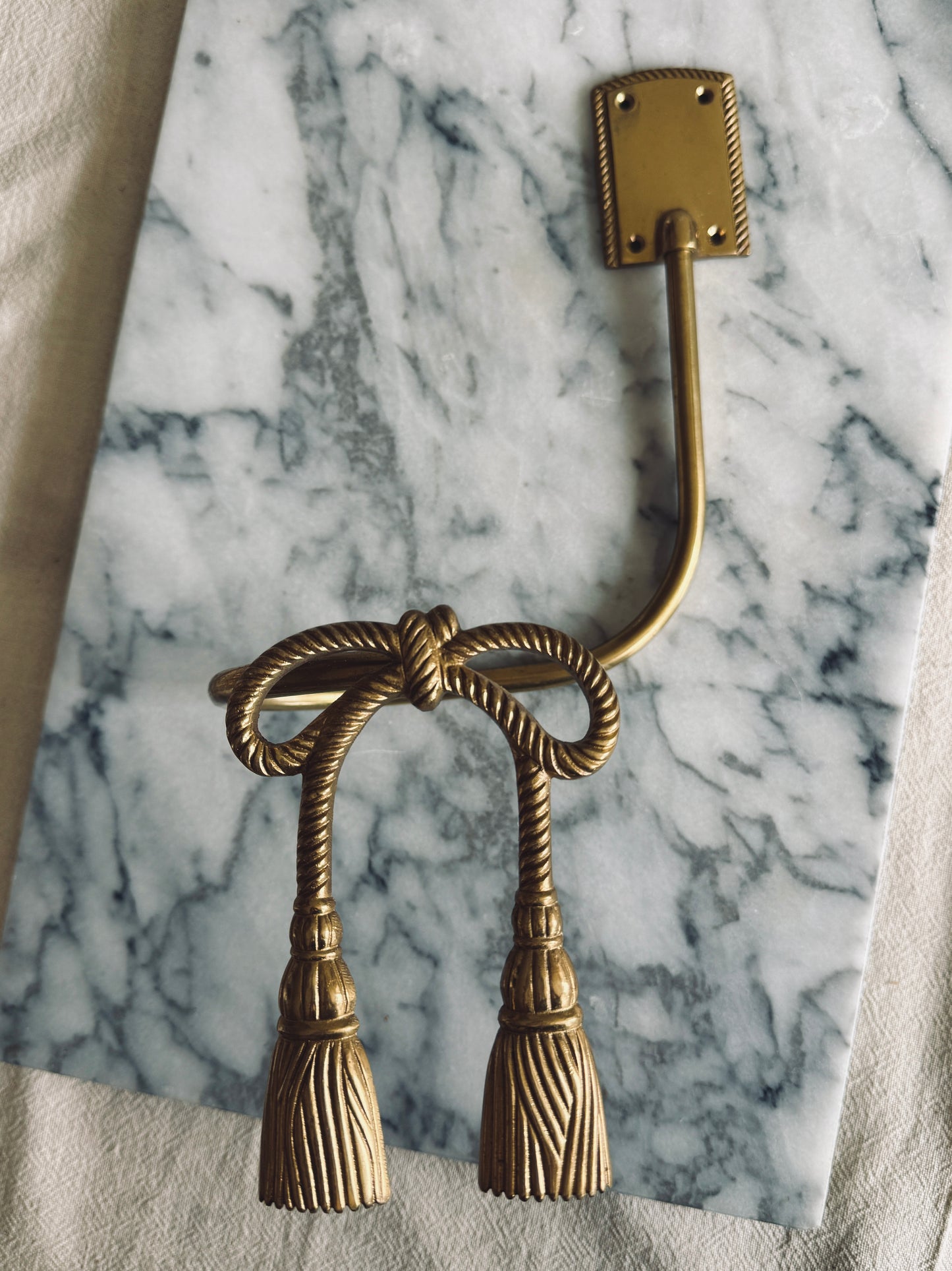 Pair of brass bow curtain tie backs