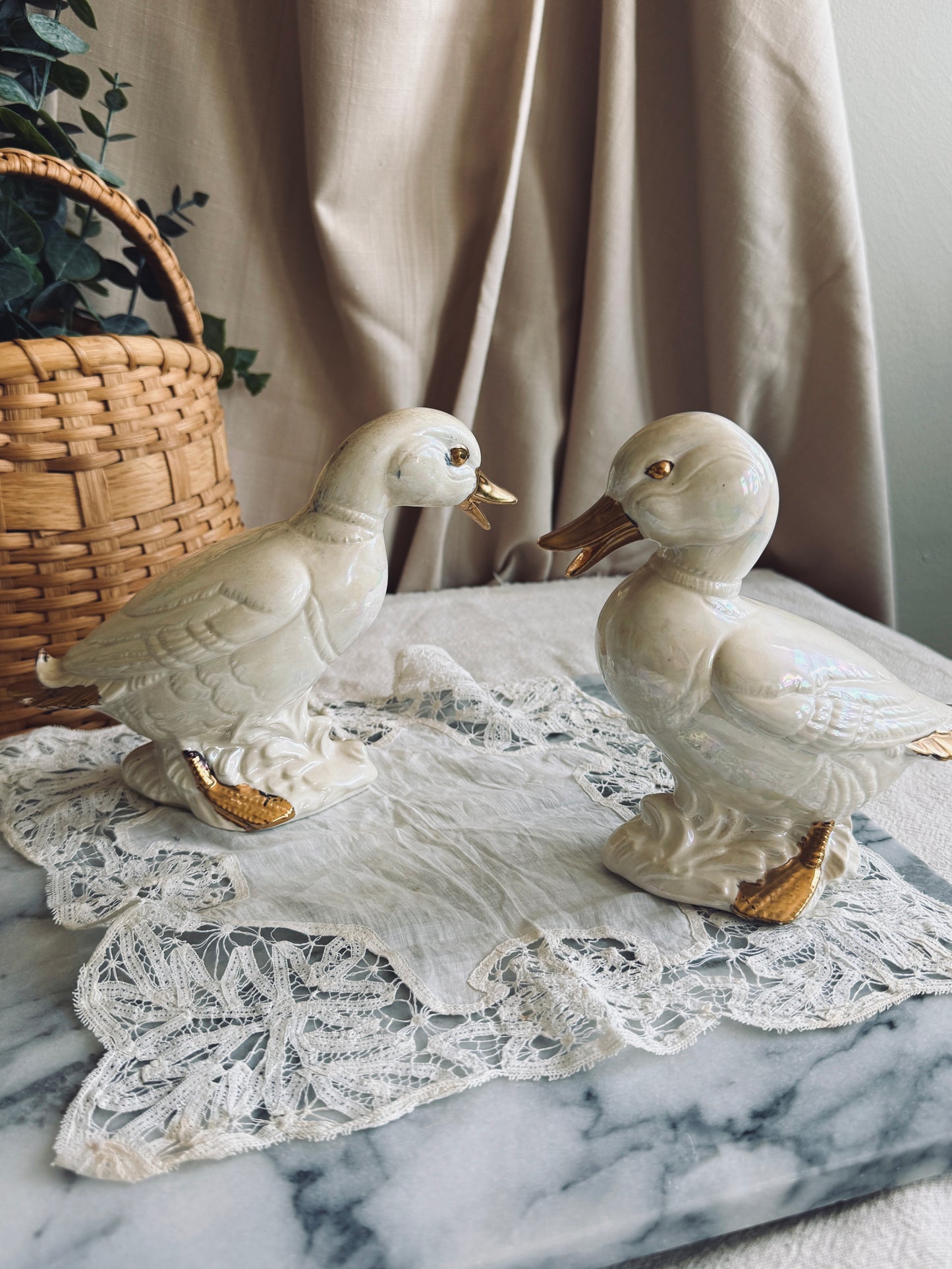 Pair of white and gold porcelain ducks