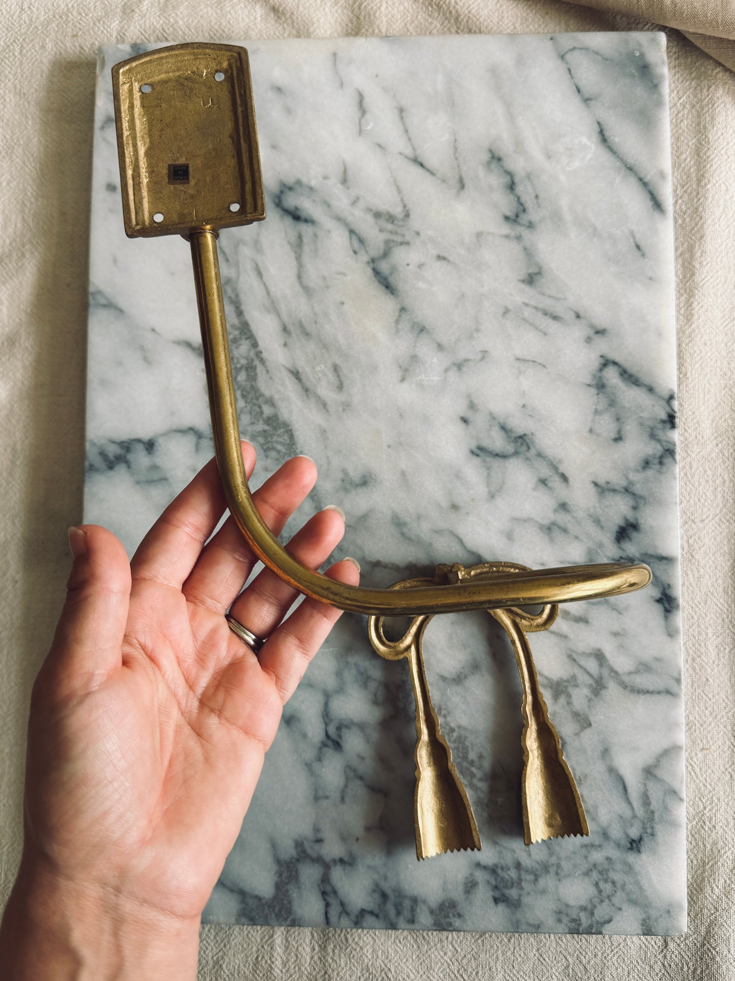 Pair of brass bow curtain tie backs