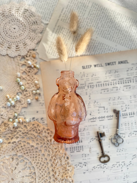 Pink glass bottle in the shape of a bear