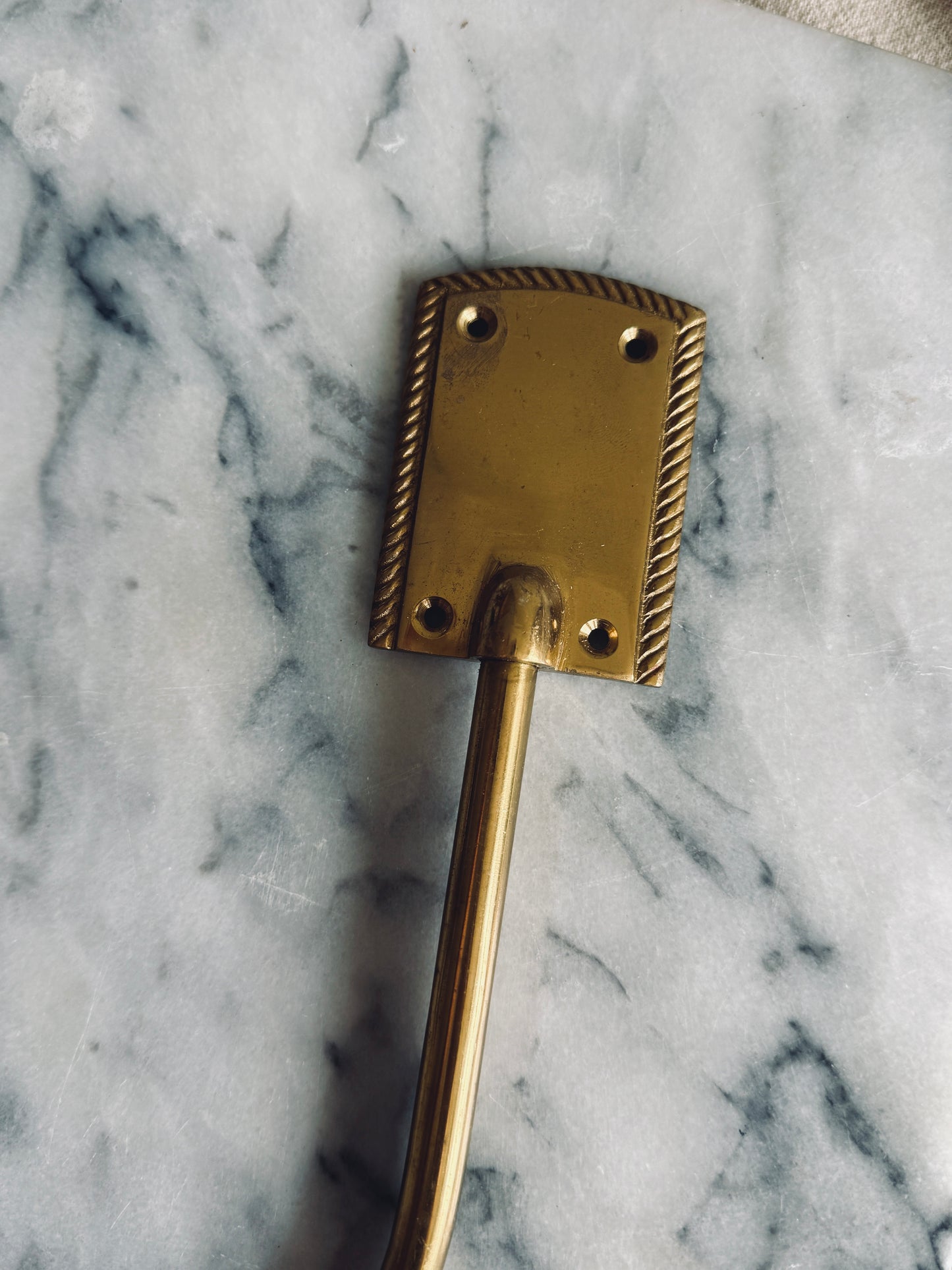 Pair of brass bow curtain tie backs