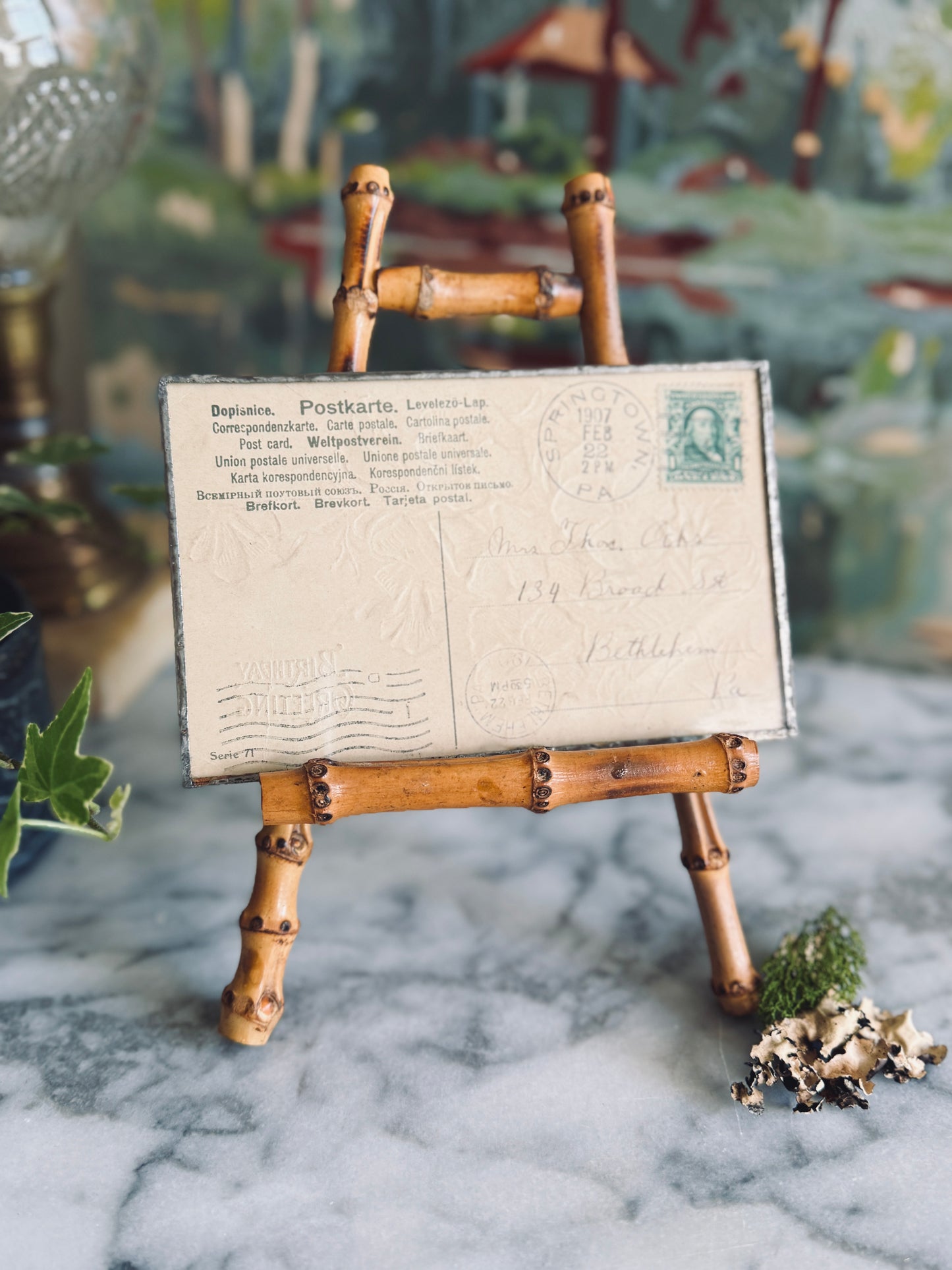 Antique postcard framed between glass