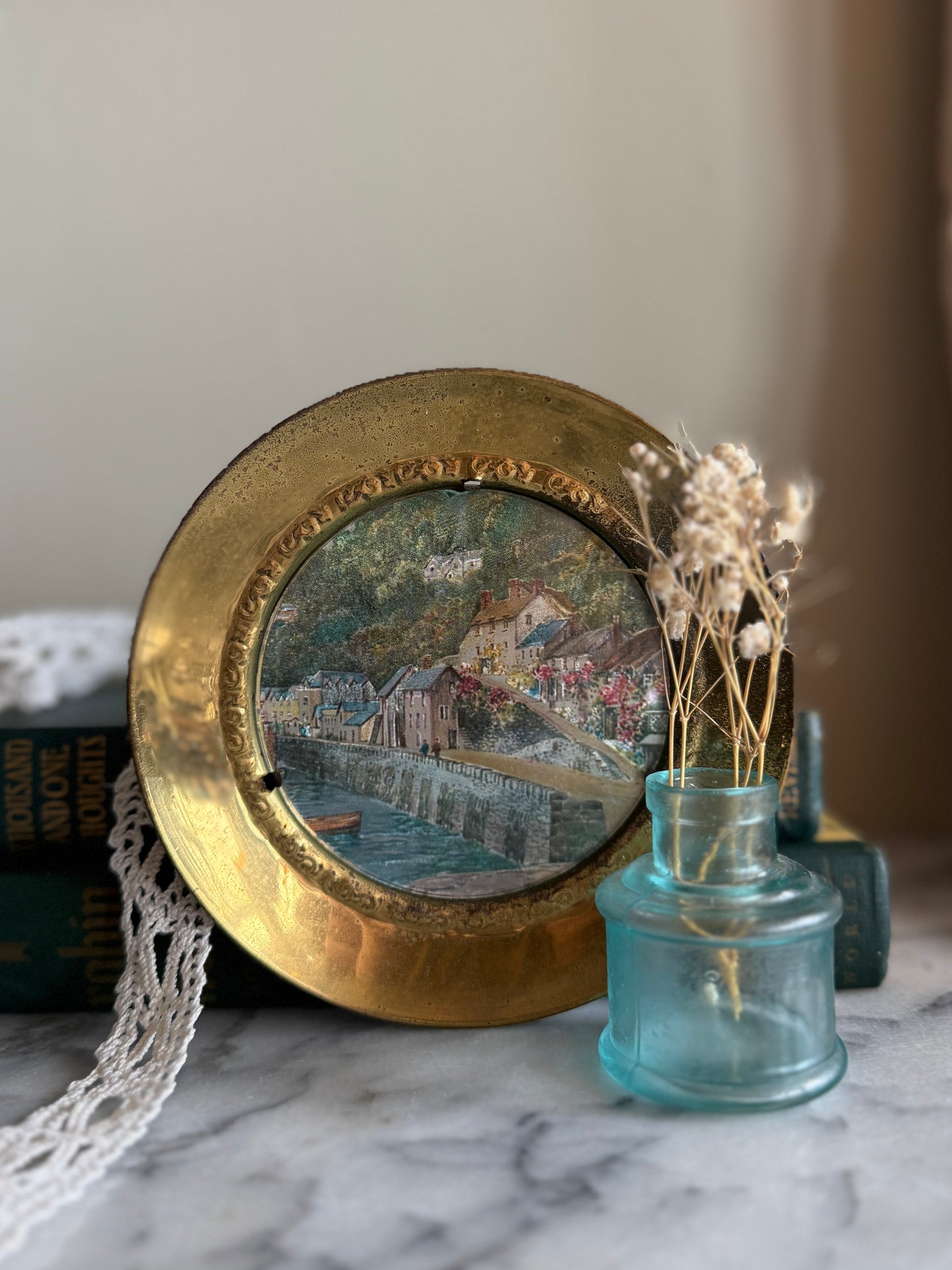 Brass wall plate with town scene