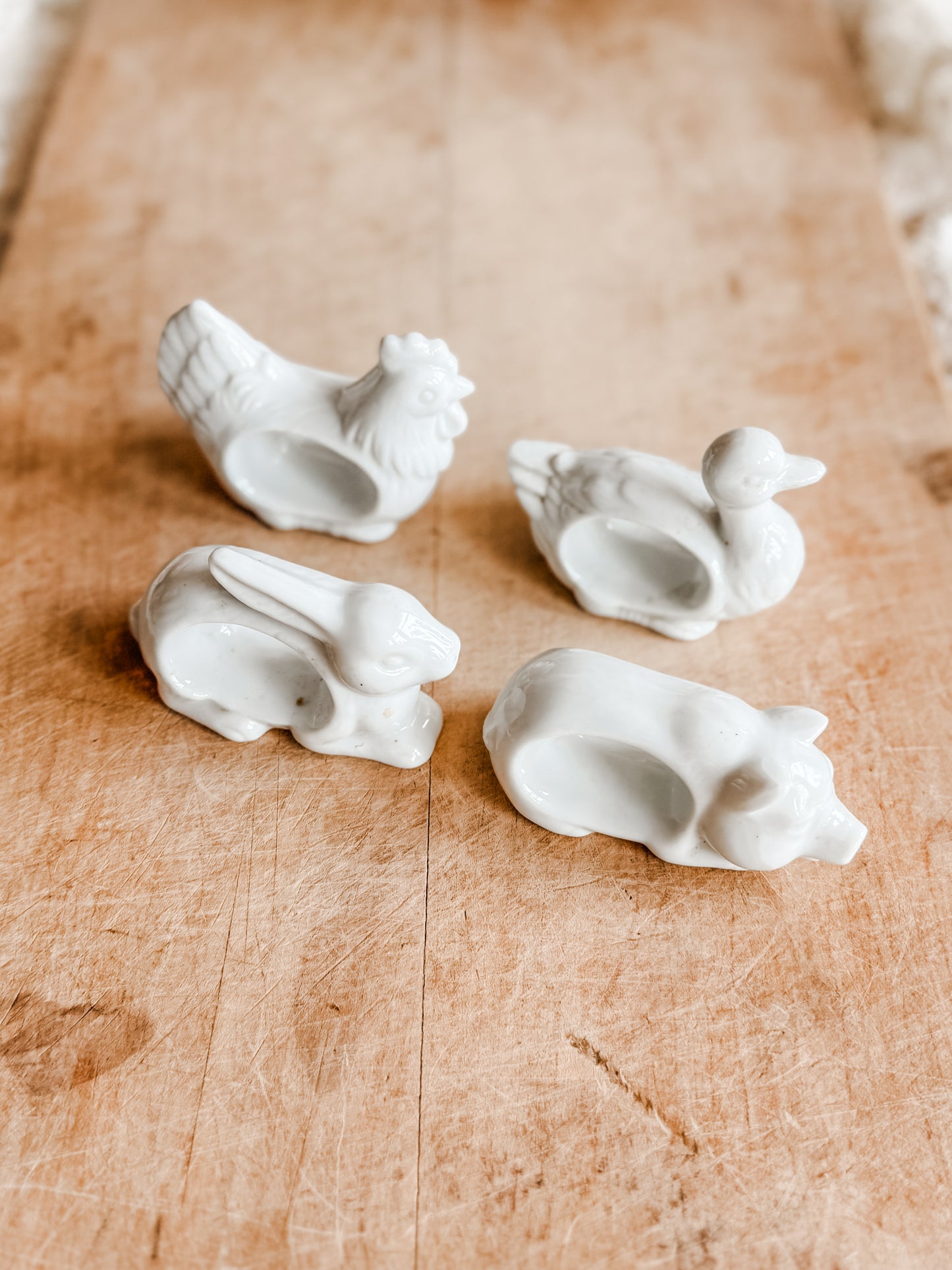Four White Porcelain Farm Animal Napkin Rings