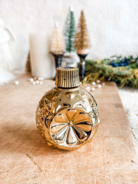 Gold Avon ornament decanter