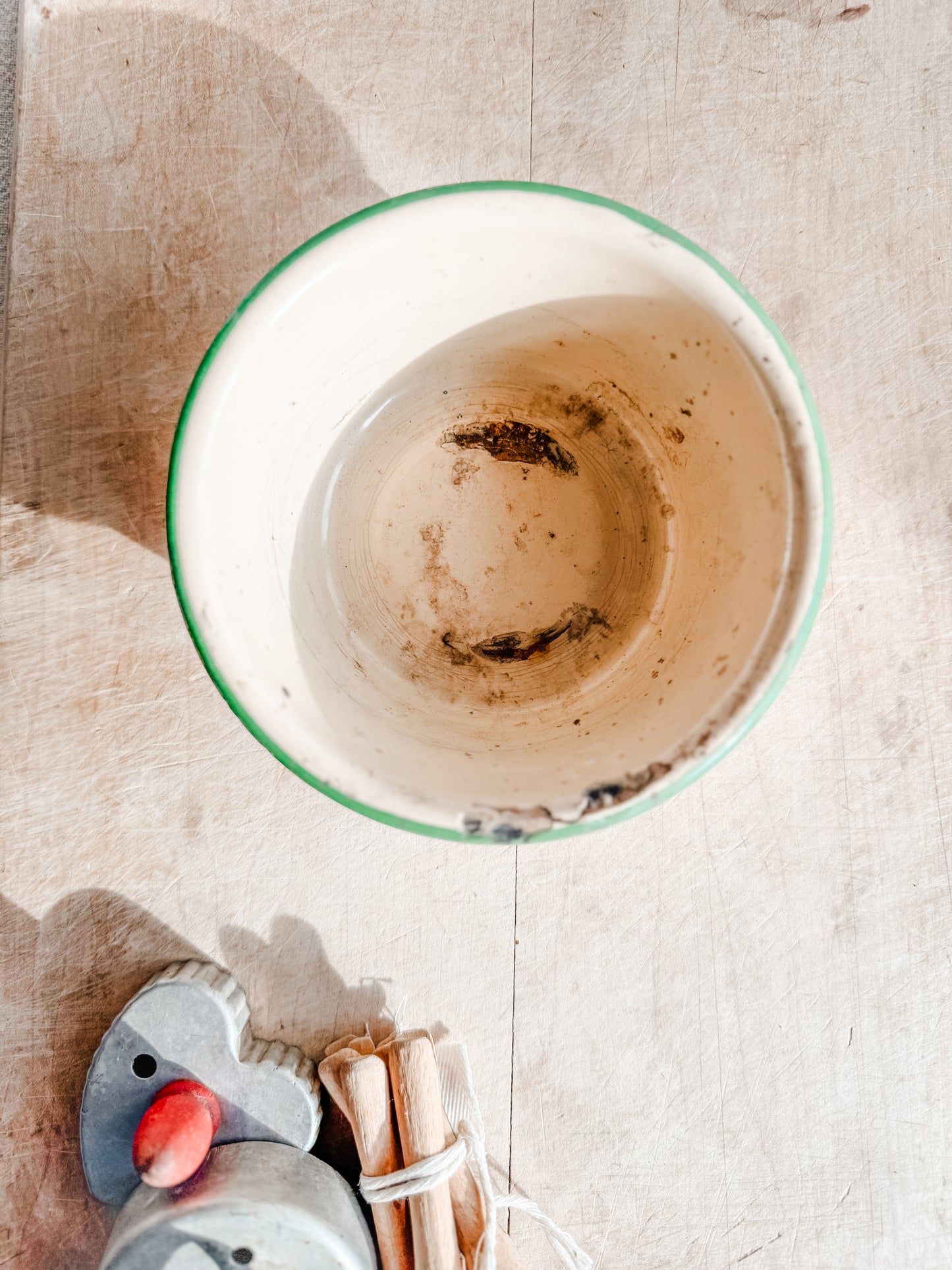 Small Green Rimmed Tan Chippy and Rusty Enamelware dish