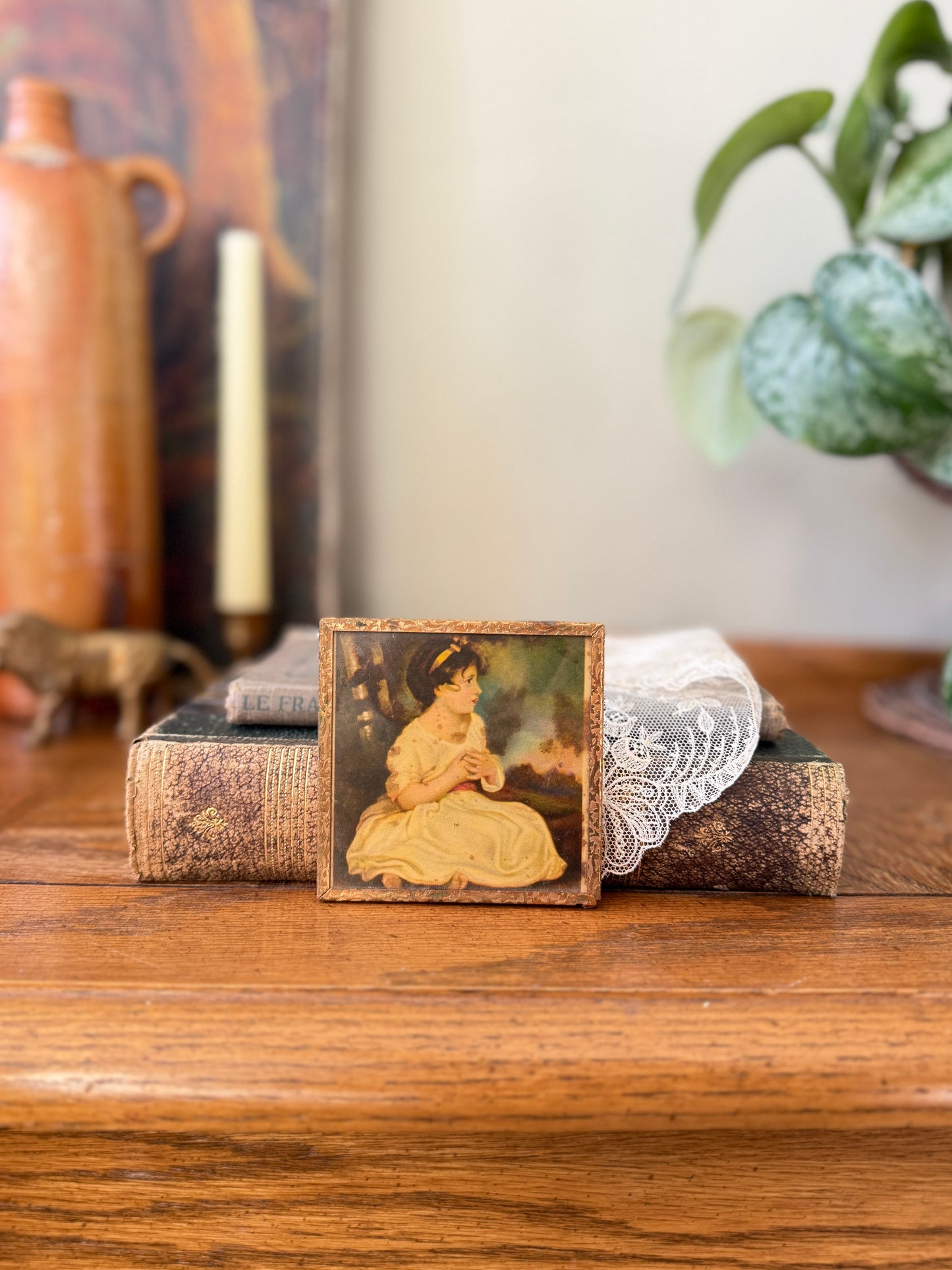 Small framed art of young girl