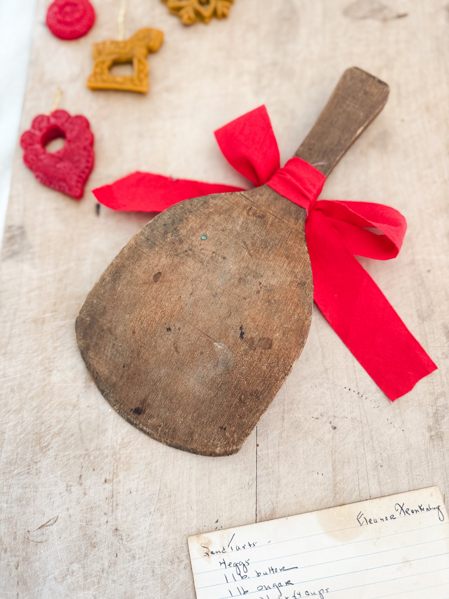 Primitive butter paddle with ribbon