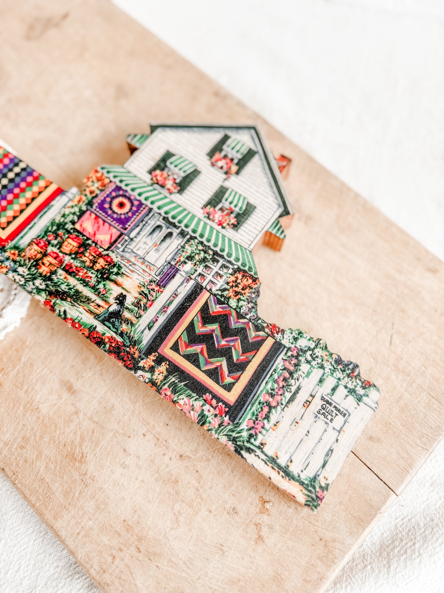 Wooden Farmhouse with hanging quilts on the line