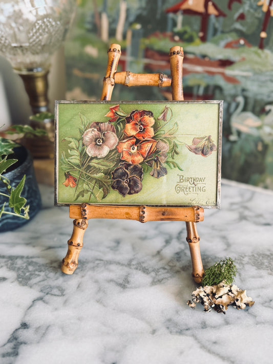Antique postcard framed between glass
