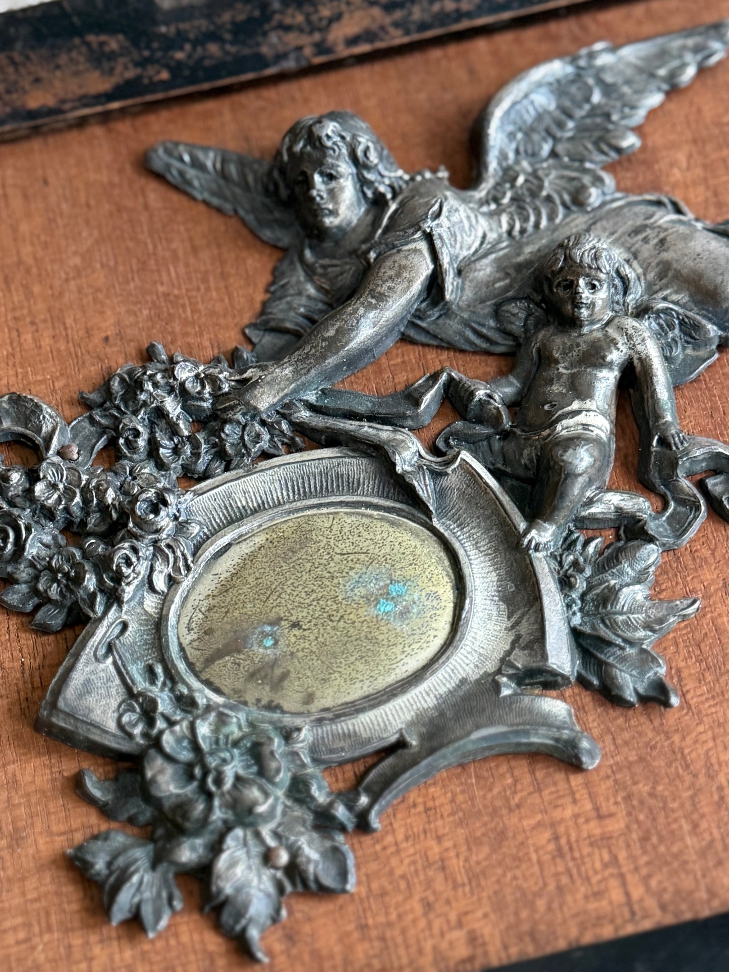 Framed late 19th century medallion of angel and cherub