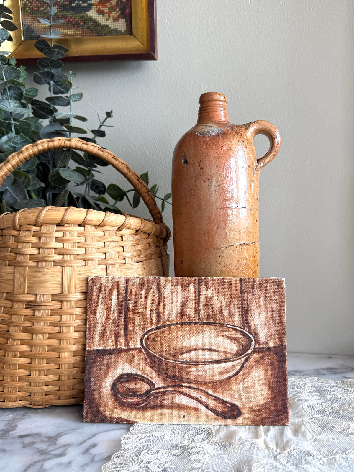 Small sepia toned still life painting on board